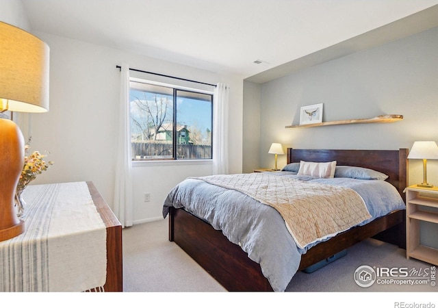 bedroom featuring carpet, visible vents, and baseboards