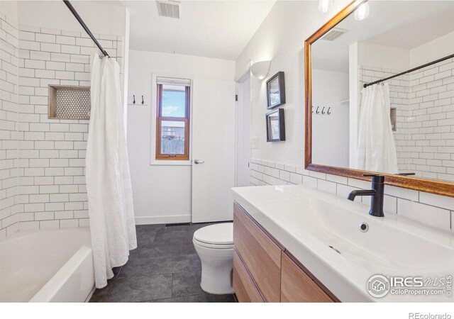 bathroom with toilet, shower / bath combo, vanity, and visible vents