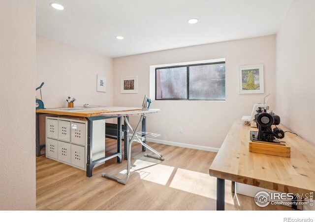 office space with baseboards, wood finished floors, and recessed lighting