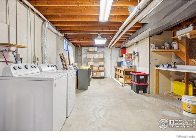 clothes washing area with laundry area and independent washer and dryer