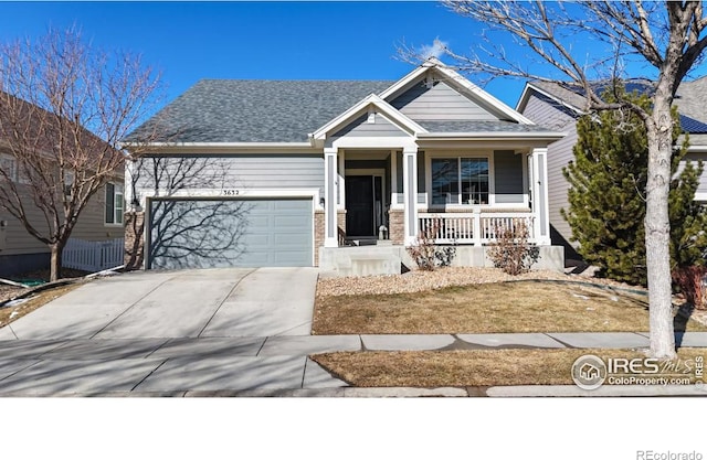 view of front of home featuring a porch, concrete driveway, a shingled roof, and a garage