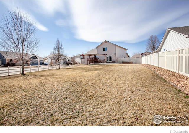 view of yard with a fenced backyard