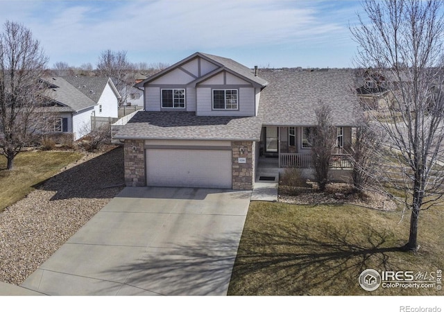 view of front of house with a shingled roof, concrete driveway, covered porch, a garage, and stone siding