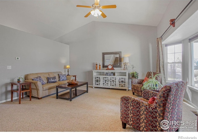 carpeted living area featuring vaulted ceiling, a ceiling fan, and baseboards