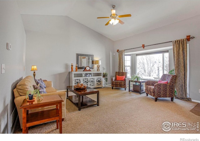 carpeted living room with baseboards, lofted ceiling, and ceiling fan