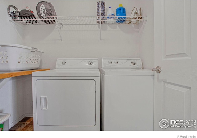 laundry area featuring separate washer and dryer and laundry area