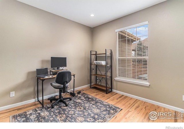 home office with baseboards, wood finished floors, and recessed lighting