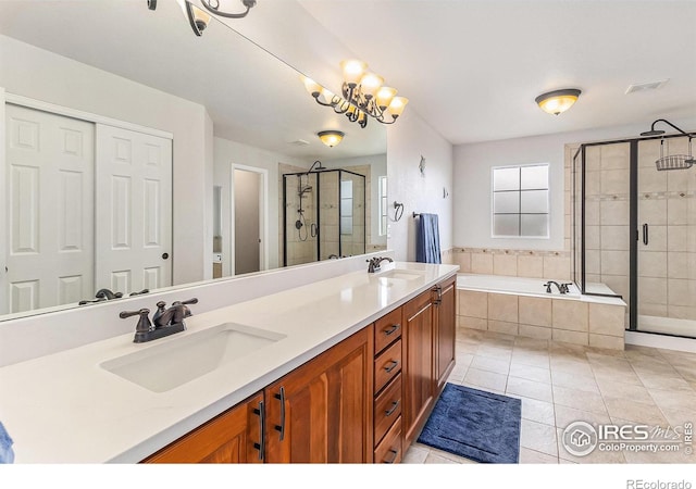 bathroom featuring a bath, a shower stall, visible vents, and a sink