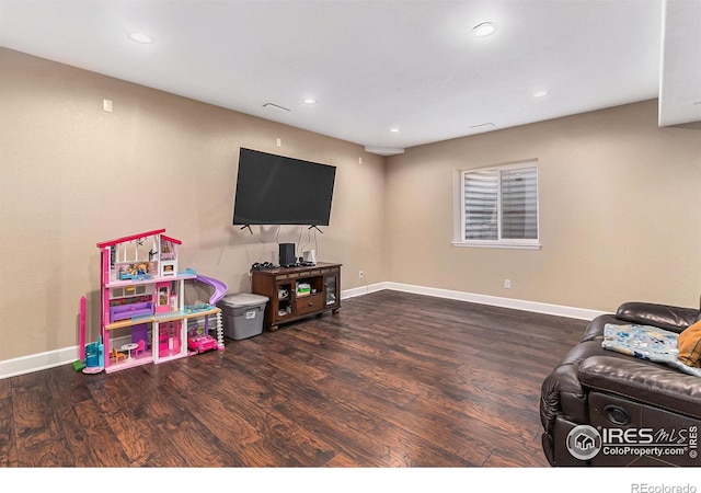 playroom featuring recessed lighting, wood finished floors, and baseboards