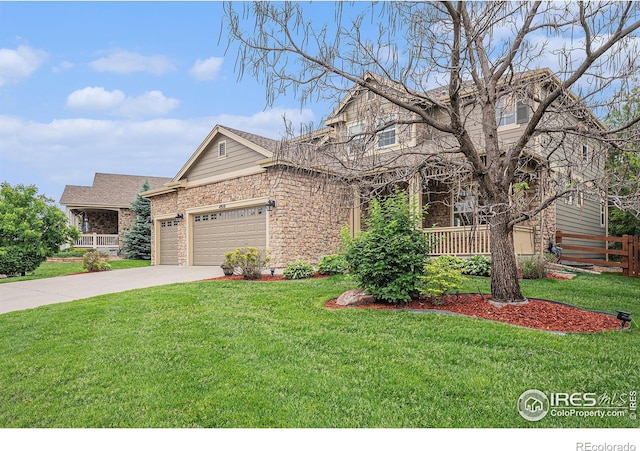 4910 Crimson Star Dr, Broomfield, CO 80023 - view of front of property featuring a garage, stone siding, and driveway