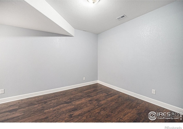 4910 Crimson Star Dr, Broomfield, CO 80023 - empty room featuring dark wood-style floors and baseboards