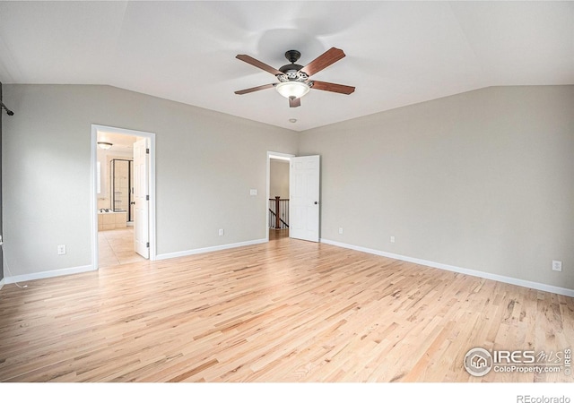 4910 Crimson Star Dr, Broomfield, CO 80023 - unfurnished bedroom featuring vaulted ceiling, light wood finished floors, connected bathroom, and a ceiling fan