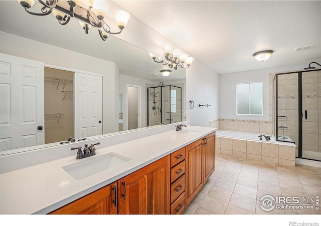 4910 Crimson Star Dr, Broomfield, CO 80023 - bathroom featuring a stall shower, a garden tub, double vanity, and tile patterned floors