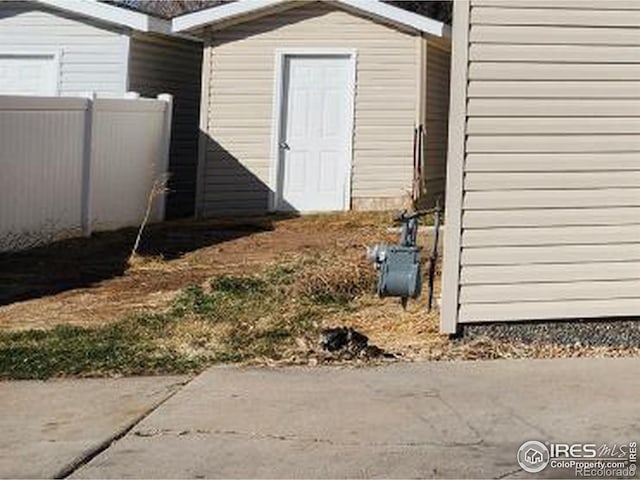 view of shed with fence