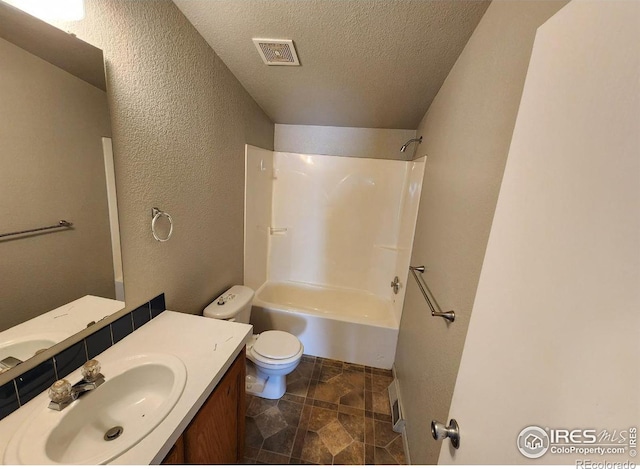 full bathroom featuring visible vents, a textured wall, toilet, a textured ceiling, and vanity