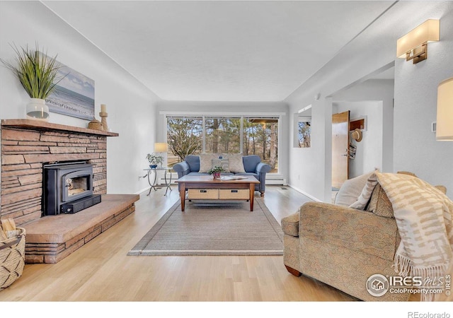 living area with wood finished floors and baseboards