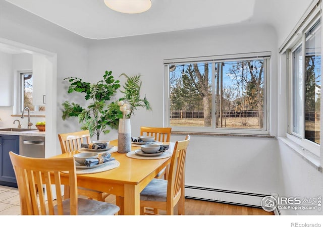 dining area with a baseboard heating unit