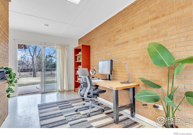 office with brick wall and tile patterned floors