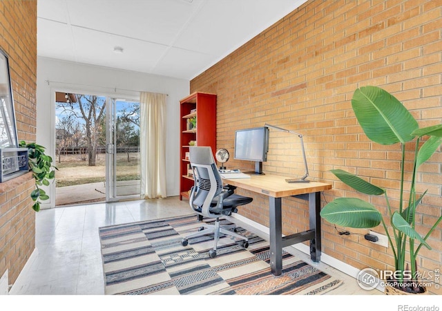 office space featuring brick wall