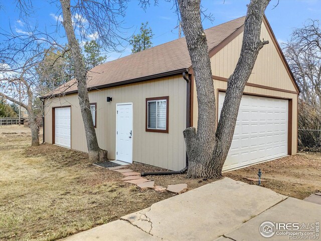 garage featuring fence