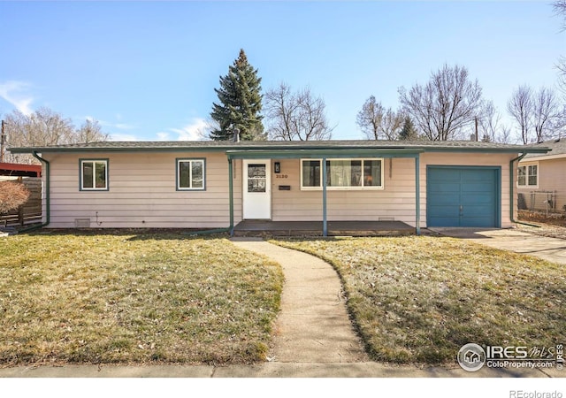 ranch-style home with concrete driveway, a front lawn, an attached garage, and fence