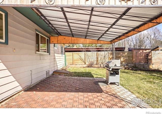 view of patio featuring fence and grilling area