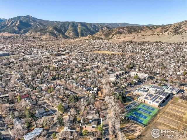 birds eye view of property with a mountain view