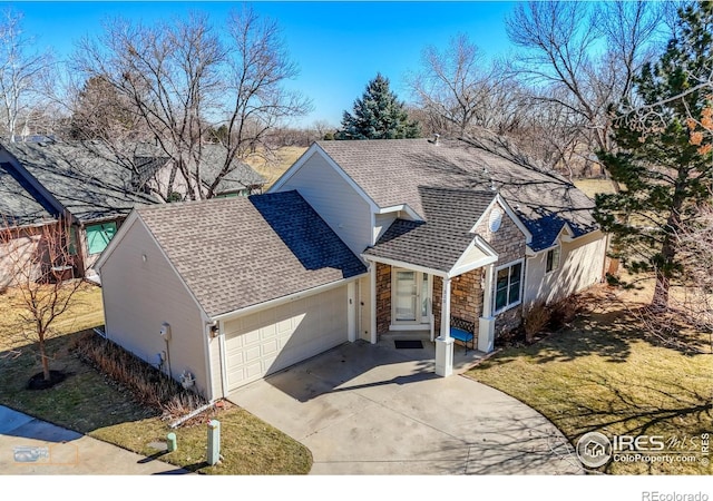 view of front of house featuring an attached garage, stone siding, concrete driveway, roof with shingles, and a front lawn