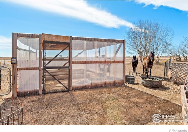 view of yard with an exterior structure and an outbuilding