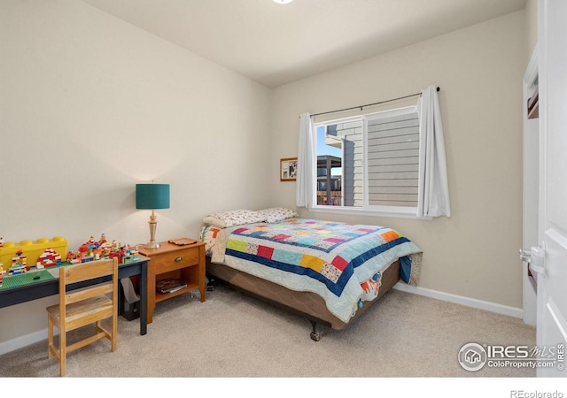 carpeted bedroom with baseboards