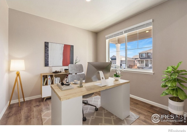 office space featuring wood finished floors and baseboards