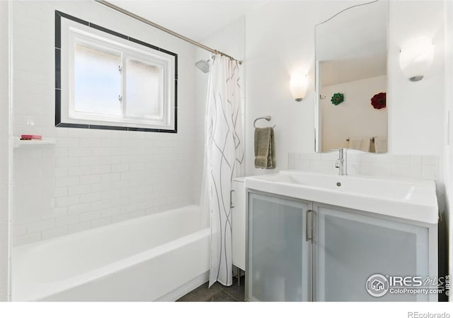 full bath featuring shower / tub combo with curtain and vanity