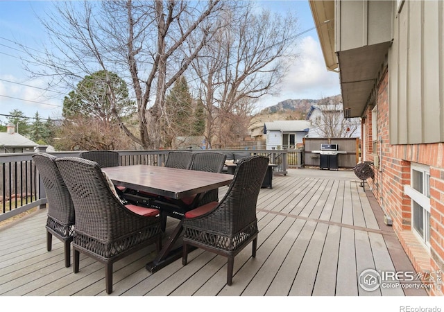 wooden deck with outdoor dining area