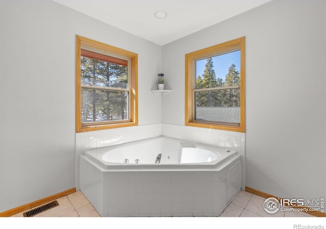 full bath featuring a healthy amount of sunlight, visible vents, and tile patterned floors