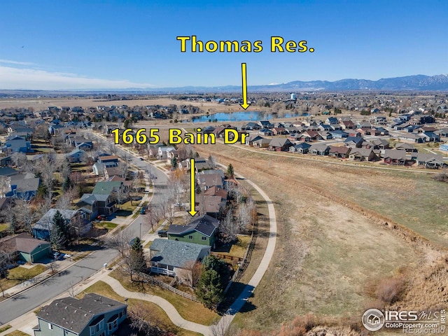 bird's eye view with a residential view and a mountain view