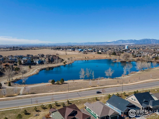 bird's eye view featuring a residential view and a water and mountain view