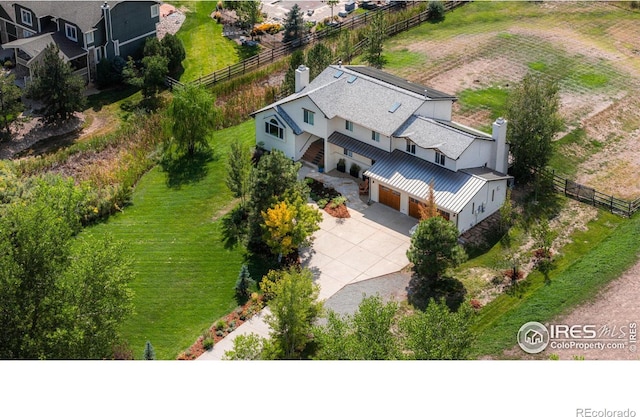 birds eye view of property with a rural view