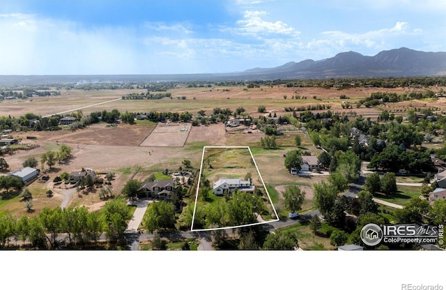 birds eye view of property featuring a rural view and a mountain view