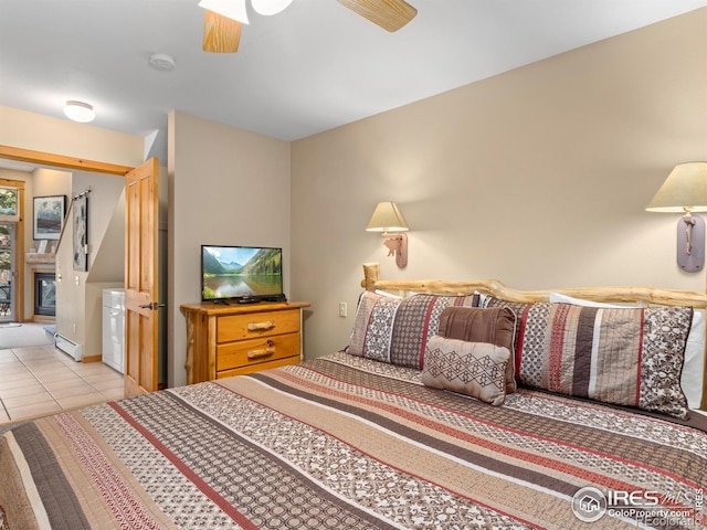 bedroom with light tile patterned floors and ceiling fan