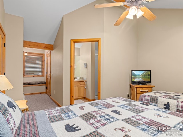 bedroom with baseboards, a ceiling fan, connected bathroom, vaulted ceiling, and carpet flooring