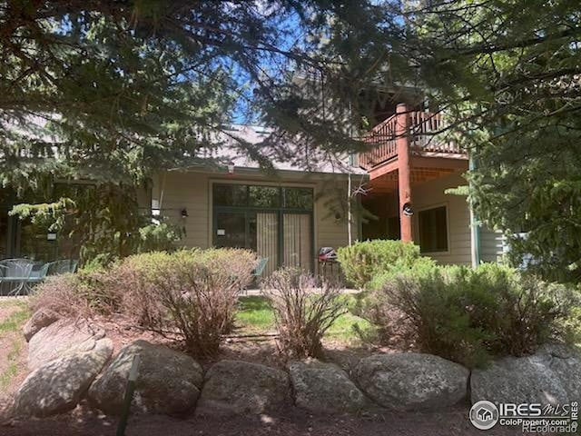 2100 Fall River Rd Unit 5, Estes Park, CO 80517 - back of house featuring a balcony