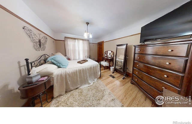 bedroom with light wood finished floors