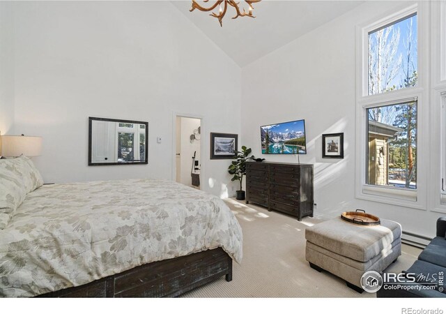 carpeted bedroom with high vaulted ceiling and a baseboard radiator