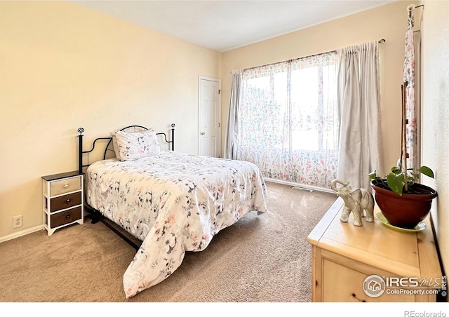 bedroom featuring visible vents, baseboards, and carpet flooring