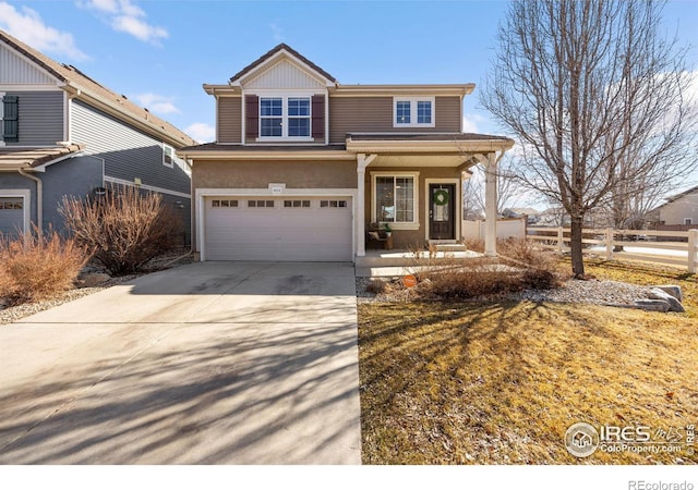 view of front of house featuring concrete driveway and an attached garage