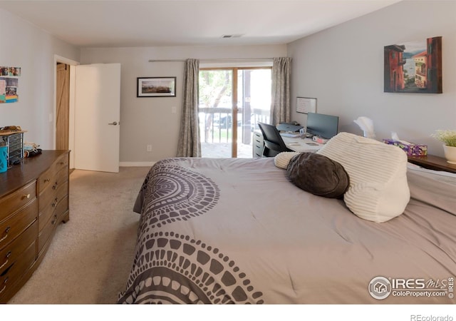 bedroom featuring access to exterior, baseboards, visible vents, and carpet flooring