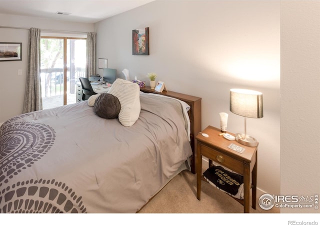 bedroom featuring carpet floors, access to exterior, and visible vents