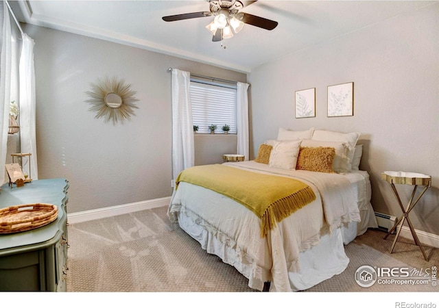 bedroom featuring light carpet, ceiling fan, baseboards, and baseboard heating