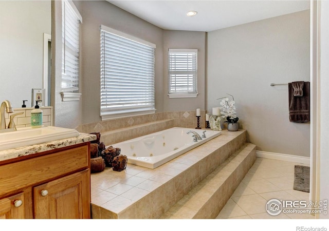 bathroom featuring vanity, a whirlpool tub, and tile patterned floors