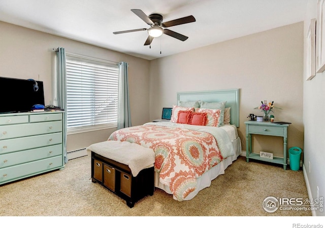 bedroom featuring a baseboard heating unit, carpet, and a ceiling fan